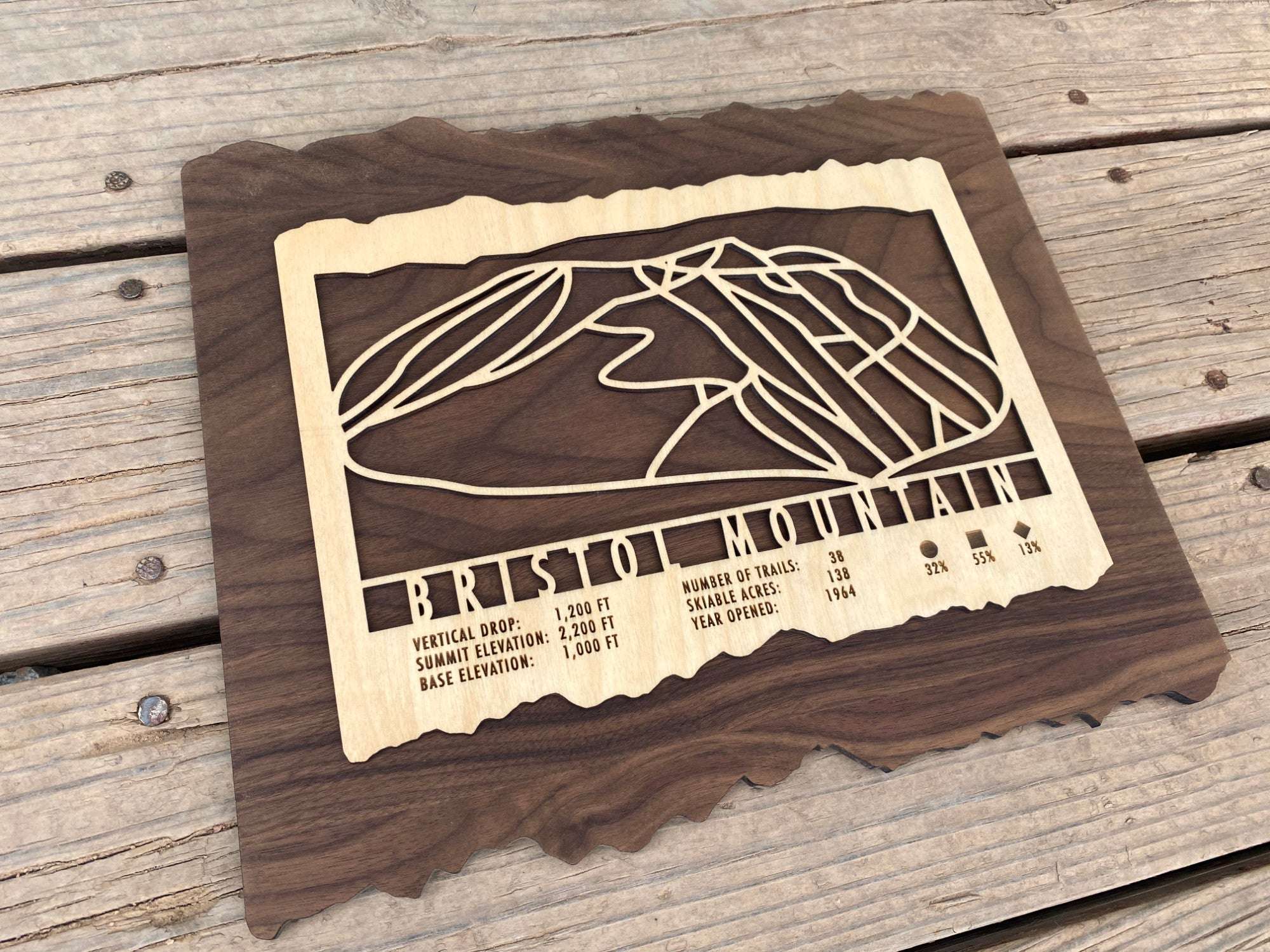Laser-cut Bristol Mountain ski trail map on wood, ideal wall art for ski lodge or home, showcasing trail layout and elevation details.