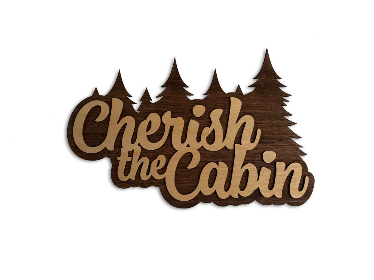 Cherish the Cabin wall sign in layered wood with pine tree silhouette, perfect rustic decor for Seinfeld fans and cabin lovers.