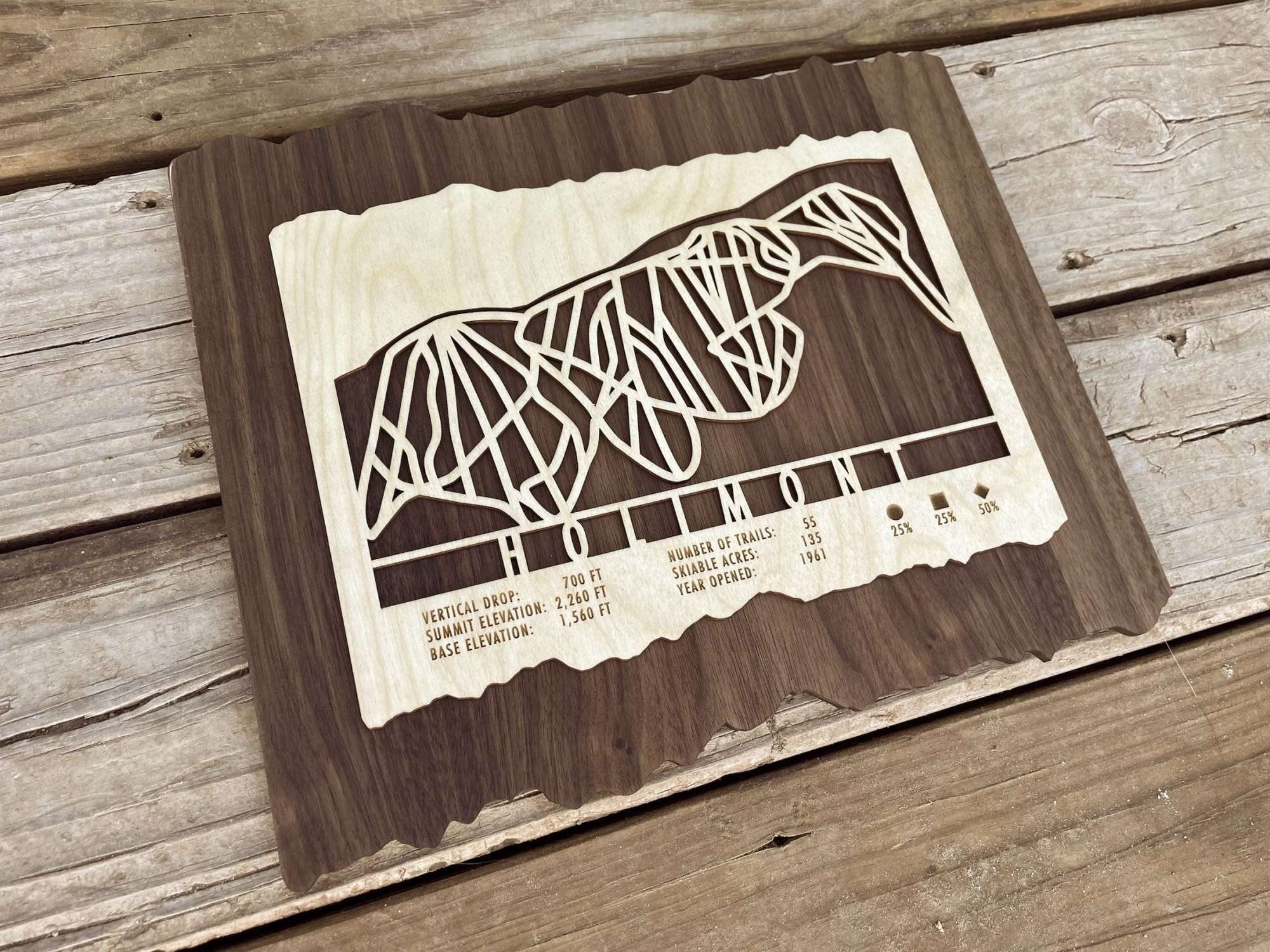 Angled view of Holimont Ski Trail Map Wall Decor  showing detailed laser-cut ski trails on wood, perfect for ski-themed interior design.