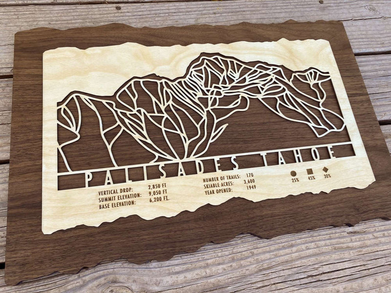 Angled view of Palisades Tahoe Ski Trail Map - Wood Ski Decor showing detailed ski trails and engraved resort information, perfect for home or office decor.