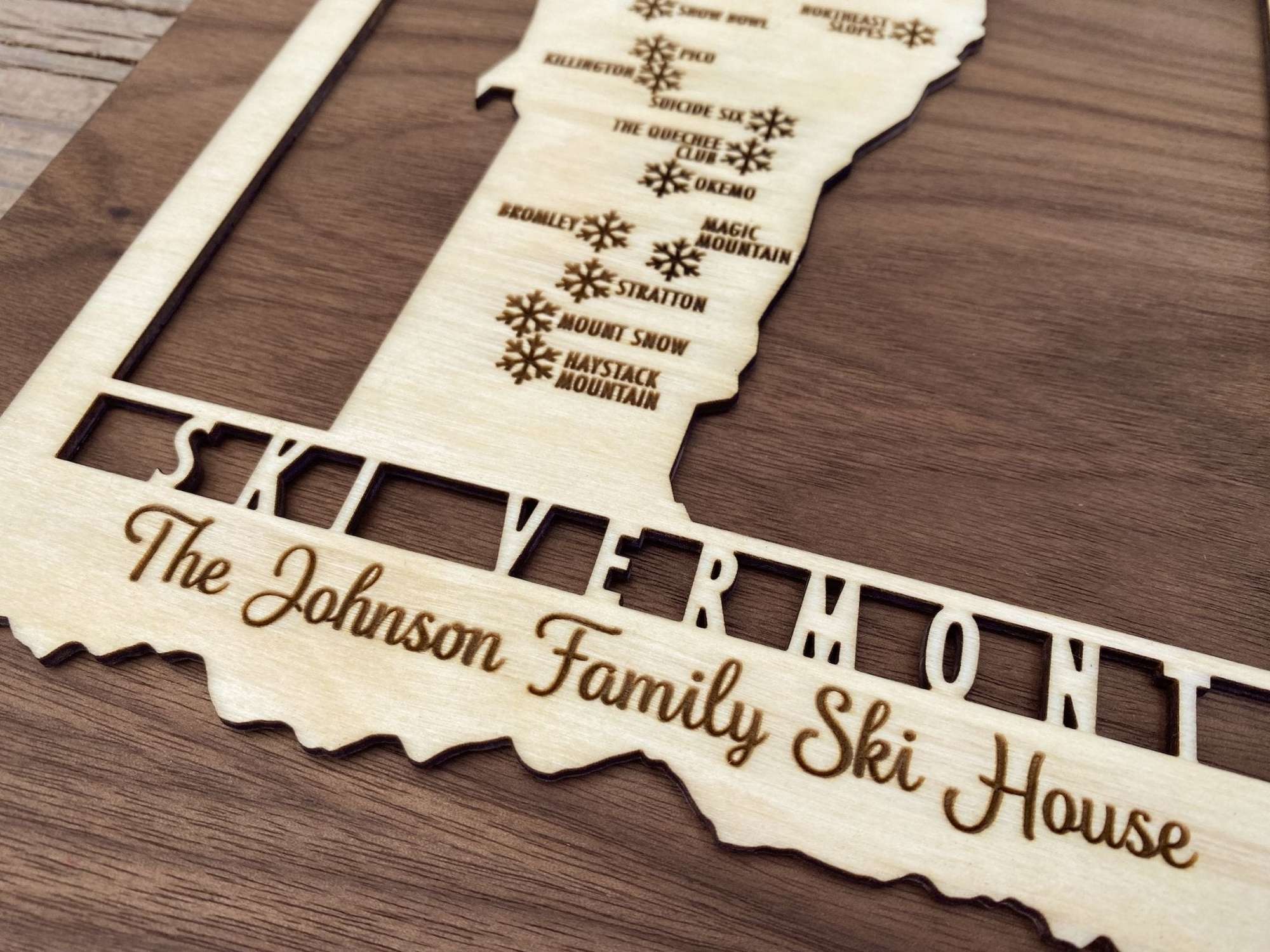 Personalized Ski Vermont wood map with engraved family name, perfect for ski house or lodge wall decoration.