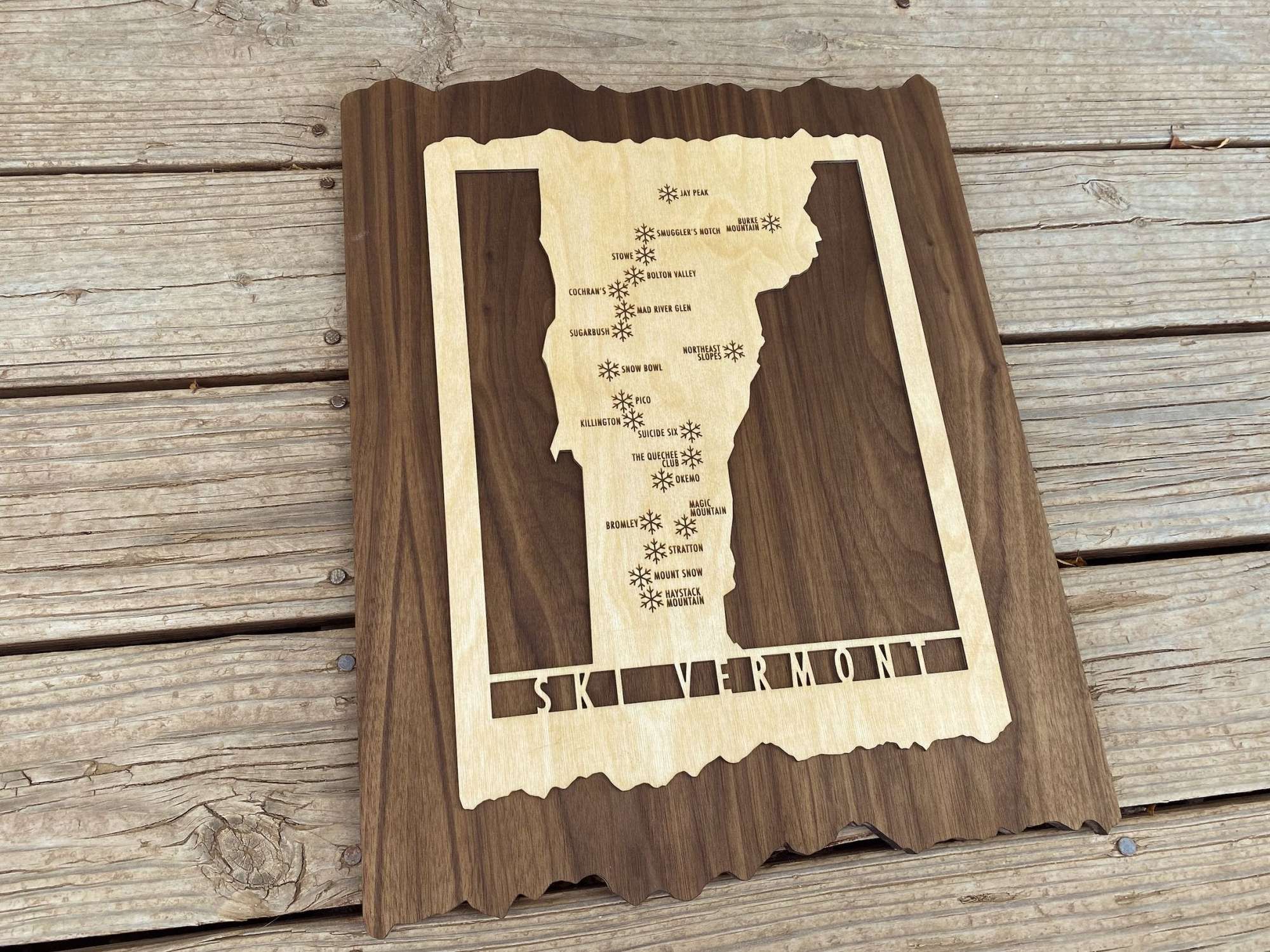 Wood ski map of Vermont ski resorts by Mountaincut, ideal for home or lodge wall decor with engraved mountain locations.