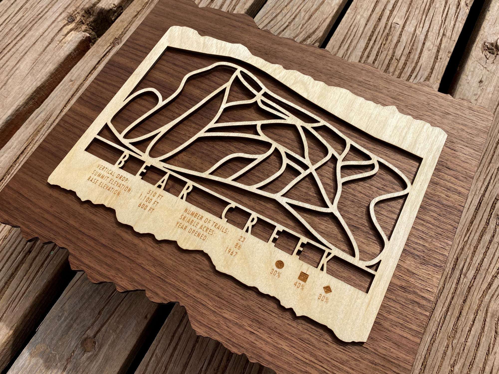 Angled view of Bear Creek Ski Trail Map highlighting precision laser-cut trails and engraved stats of this Pennsylvania ski area.