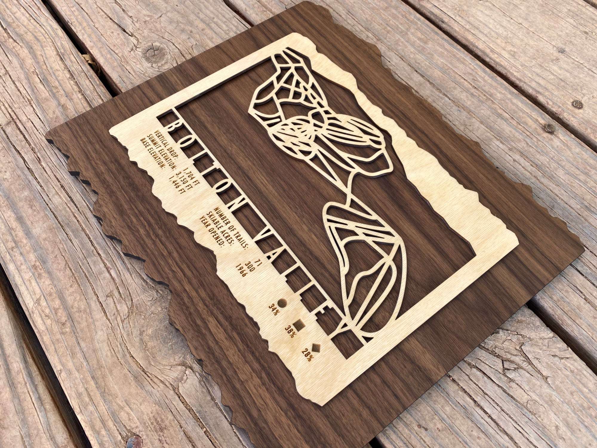 Angled view of Bolton Valley Ski Trail Map - Wood Wall Decor by Mountaincut, highlighting laser-cut ski trails and natural wood grain for home or ski lodge decoration.