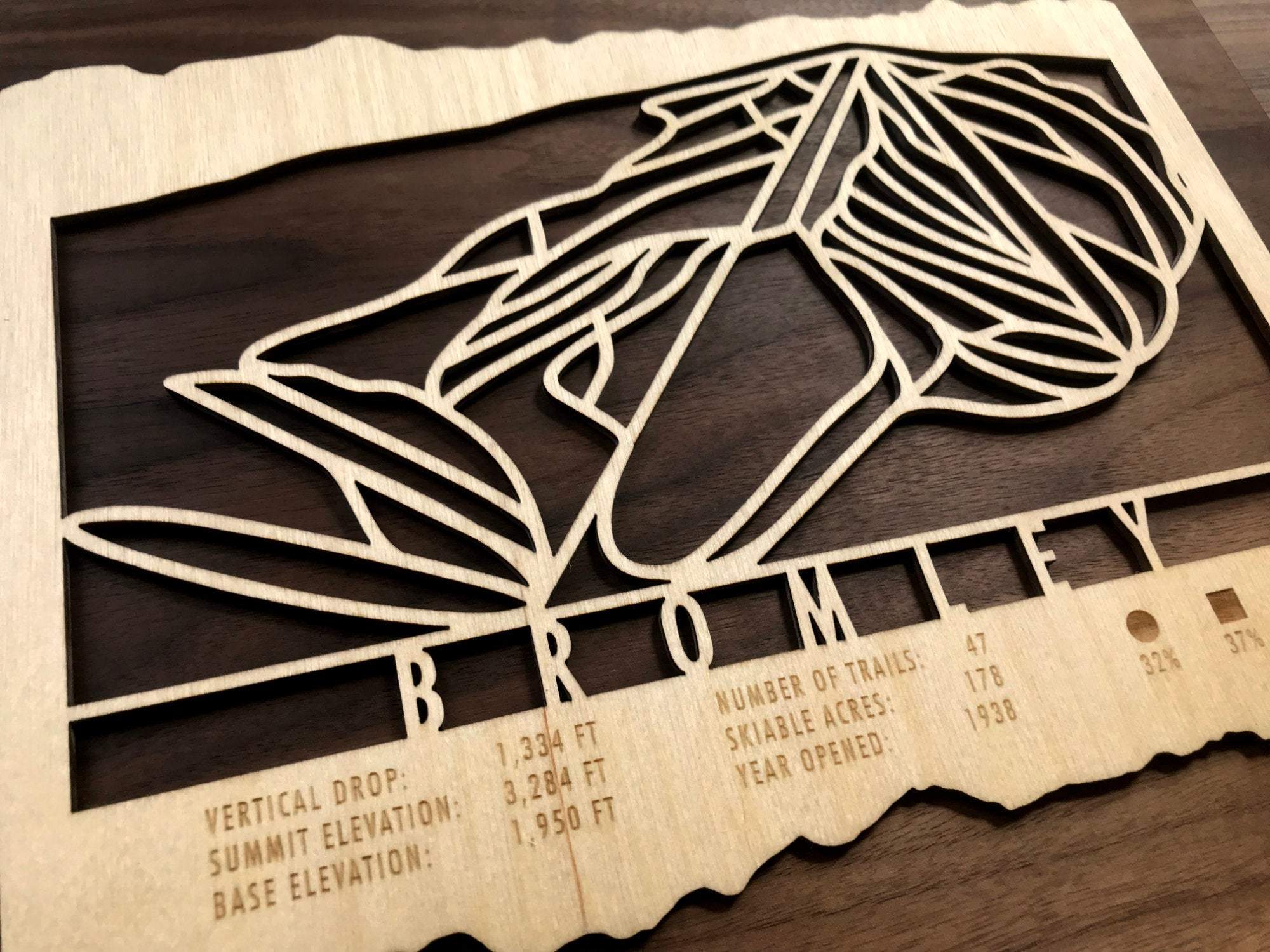 Close-up of Bromley Ski Trail Map showing engraved trail lines, resort stats, and natural wood texture, perfect for ski lodge wall decor.