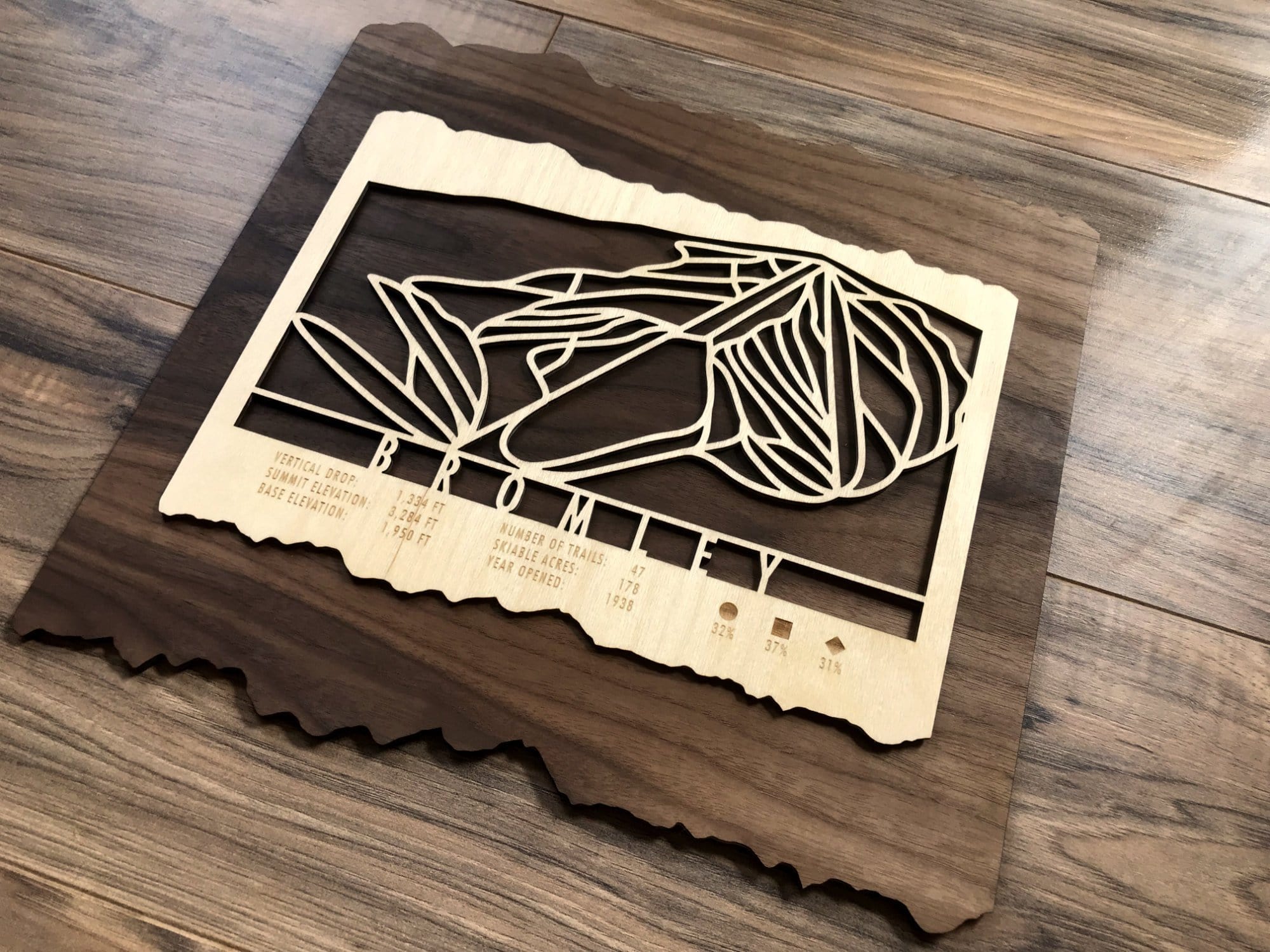 Angled view of Bromley Ski Trail Map - Ski Decor - with detailed ski trail engraving on layered wood, ideal for ski-themed interiors.