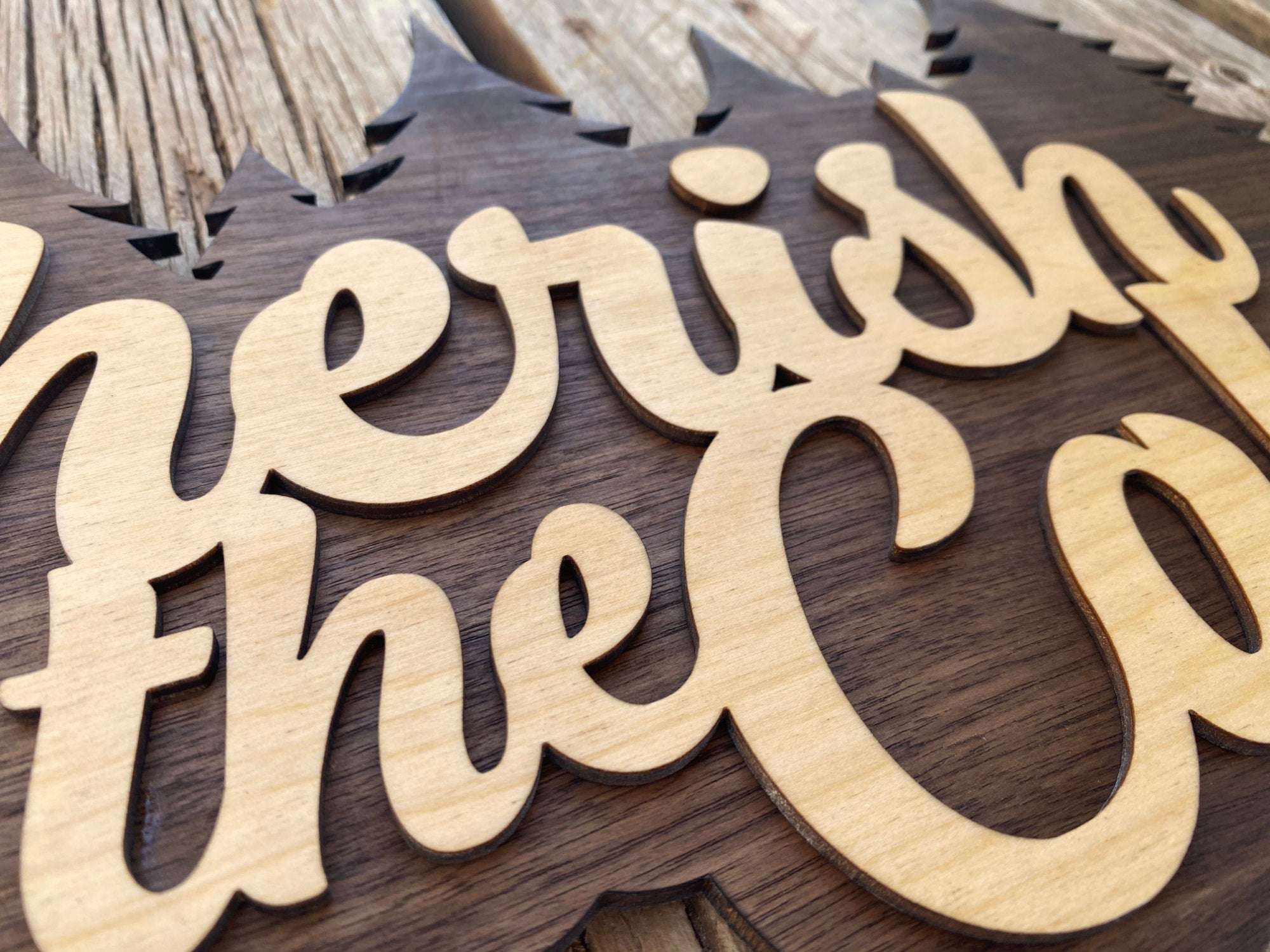 Close-up of Cherish the Cabin wood sign showing detailed laser-cut lettering and smooth finish, ideal for cabin wall decor.