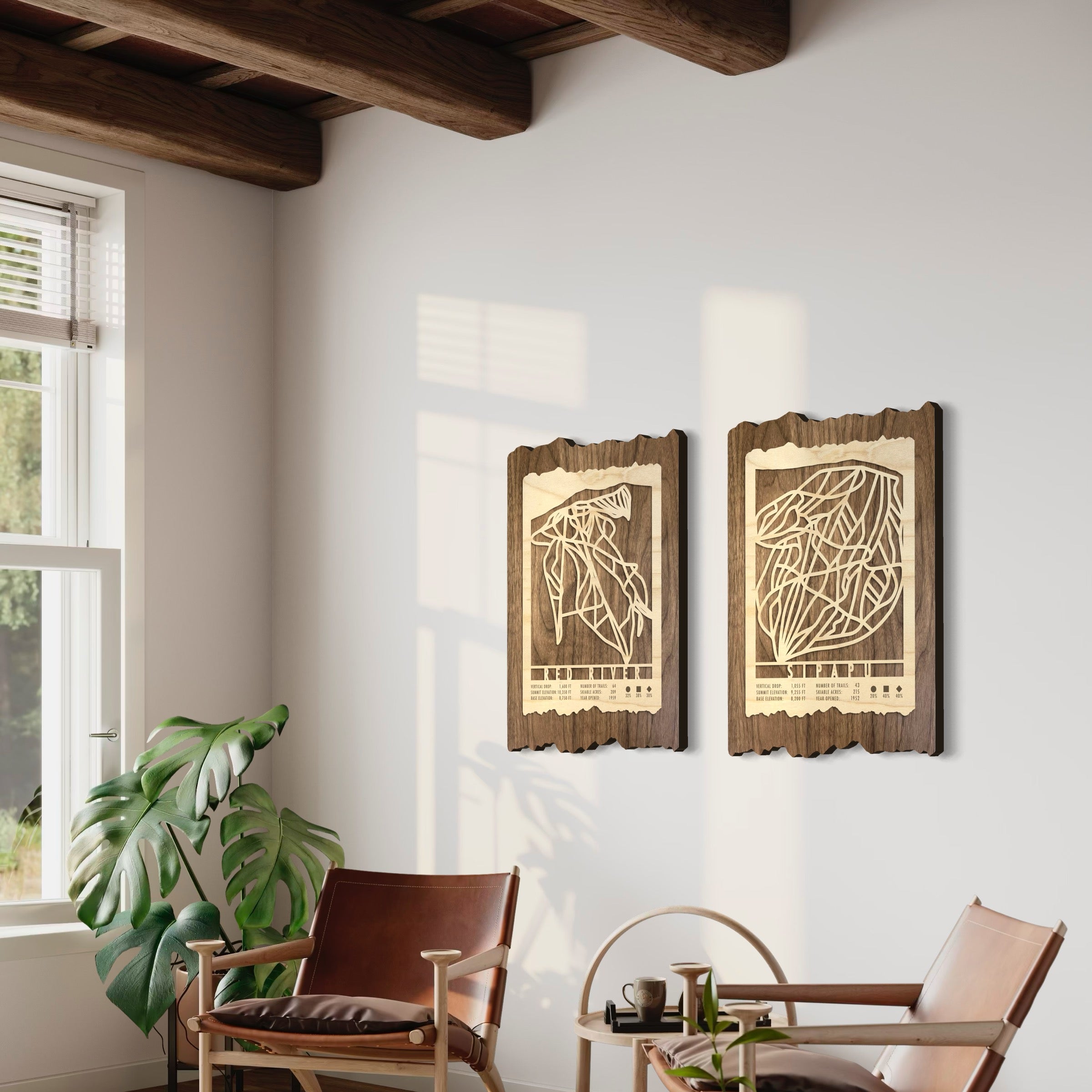 Wood ski trail map of Red River and Sipapu in New Mexico. Hanging on a white wall above furniture.