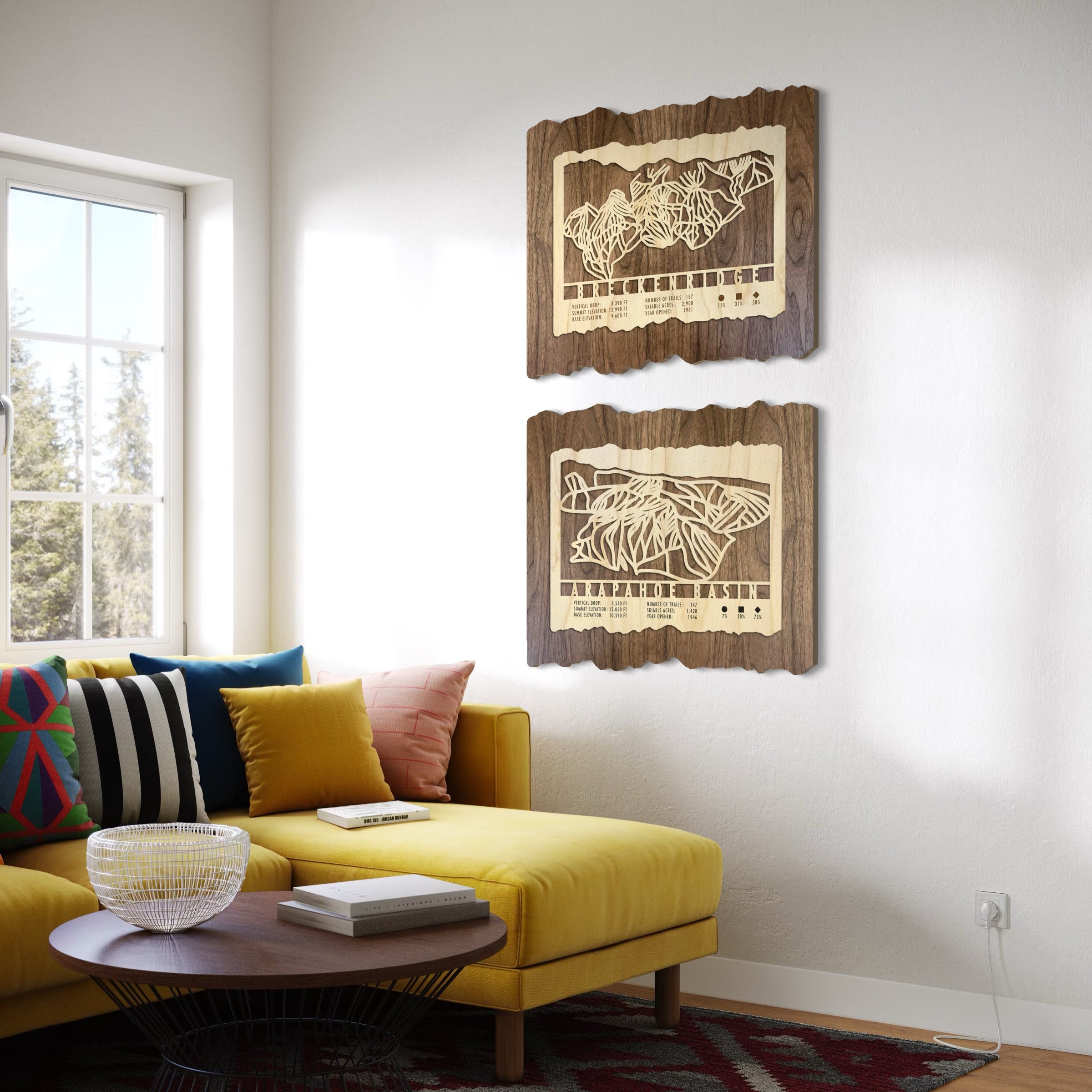 Two Mountaincut ski trail maps hanging on wall - Breckenridge and Arapahoe Basin ski trail maps