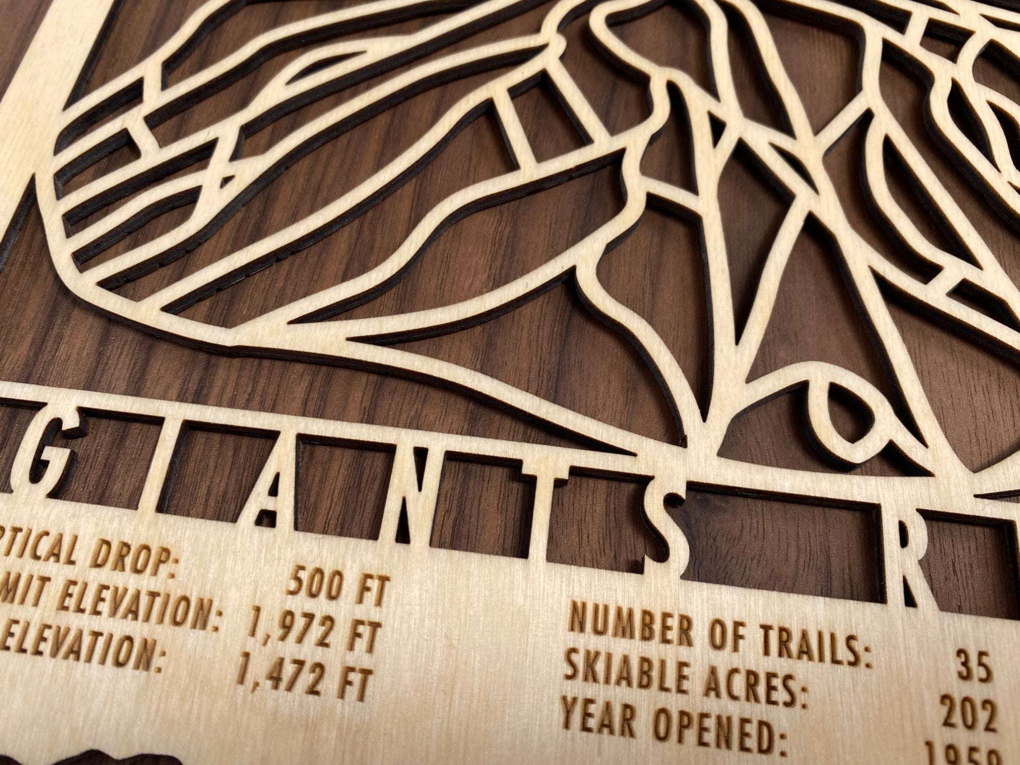 Detailed view of Giants Ridge wooden ski map highlighting precision-cut trail layout and engraved resort statistics for home or lodge decor.