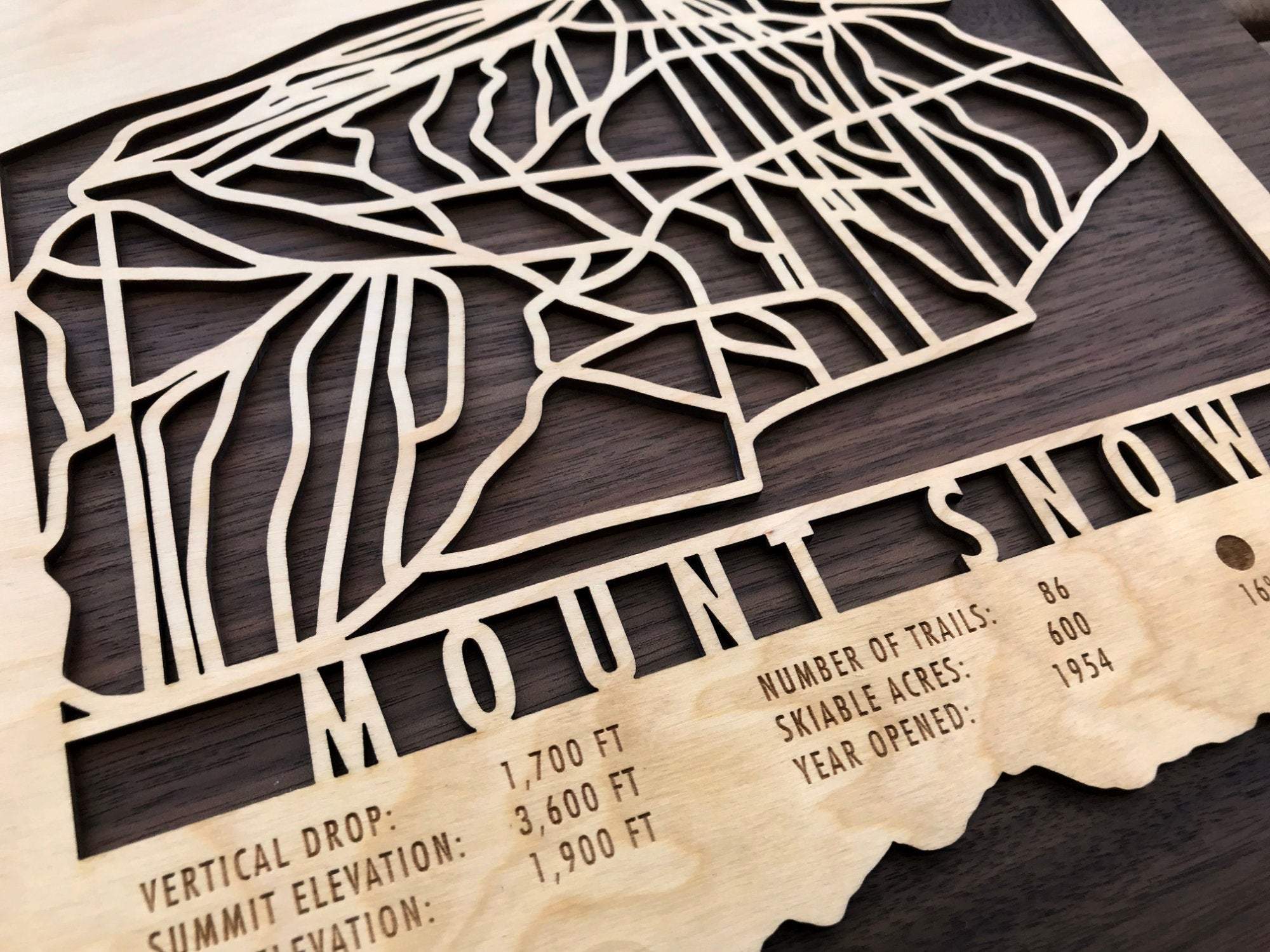 Detailed view of Mount Snow Ski Trail Map - Wood Wall Decor showing engraved resort stats and trail layout, perfect for Vermont ski home decoration.