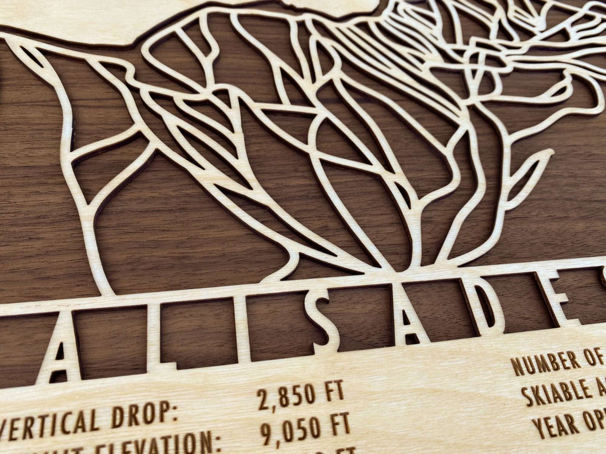 Close-up of Palisades Tahoe Ski Trail Map - Wood Ski Decor highlighting precision laser-cut trails and engraved elevation details for ski enthusiasts.
