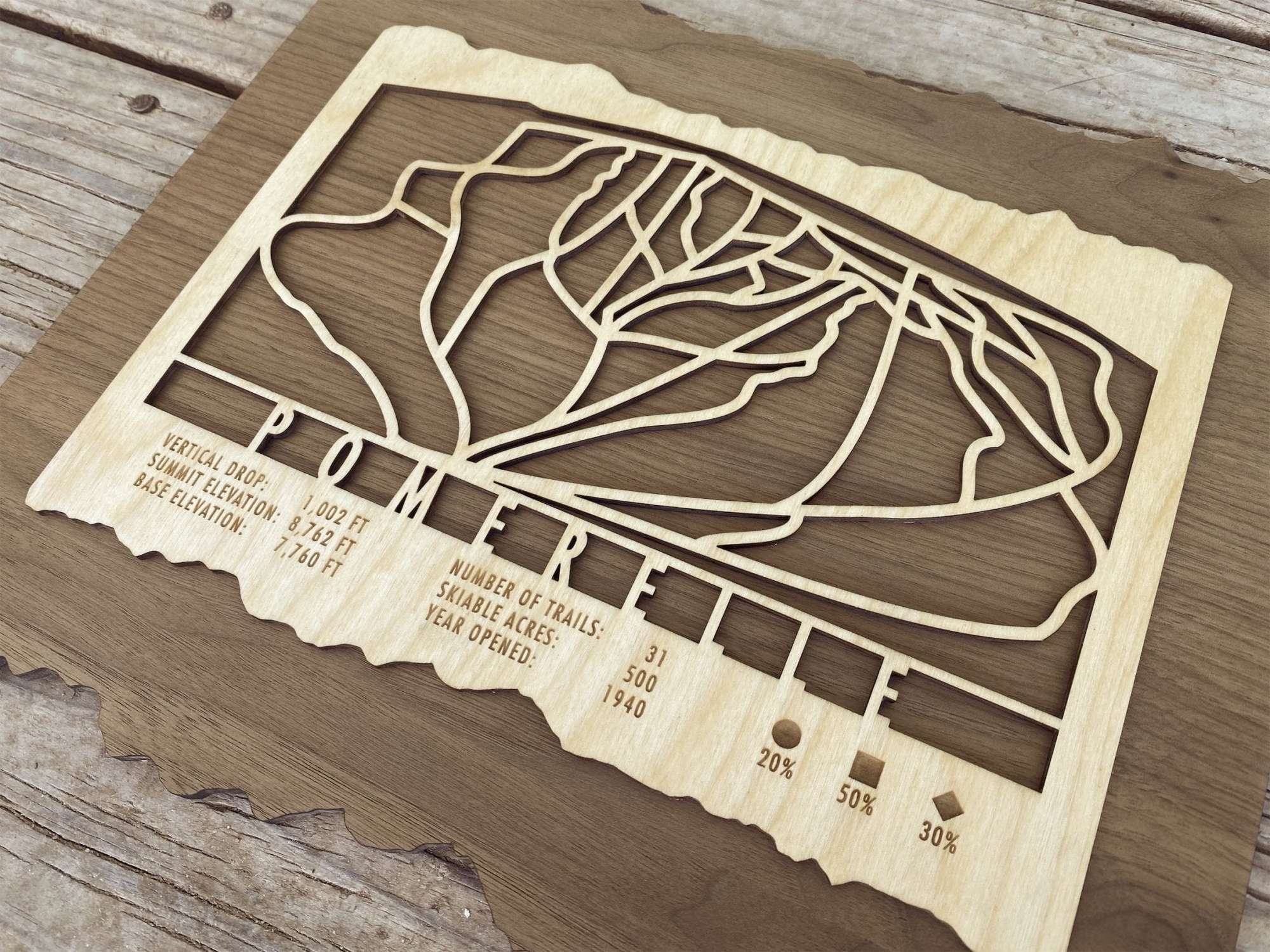 Close-up of Pomerelle Ski Trail Map - Wood Ski Decor - Mountaincut showing engraved trail lines and resort details, perfect gift for skiers.