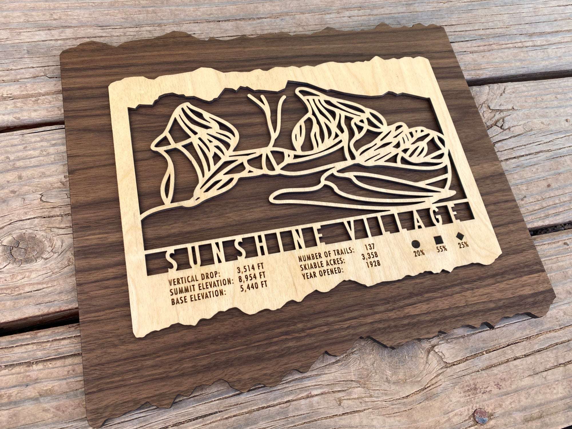 Angled view of Sunshine Village Ski Trail Map - Wood Wall Art showing engraved trail lines and resort details, ideal for ski lodge or cabin decoration.