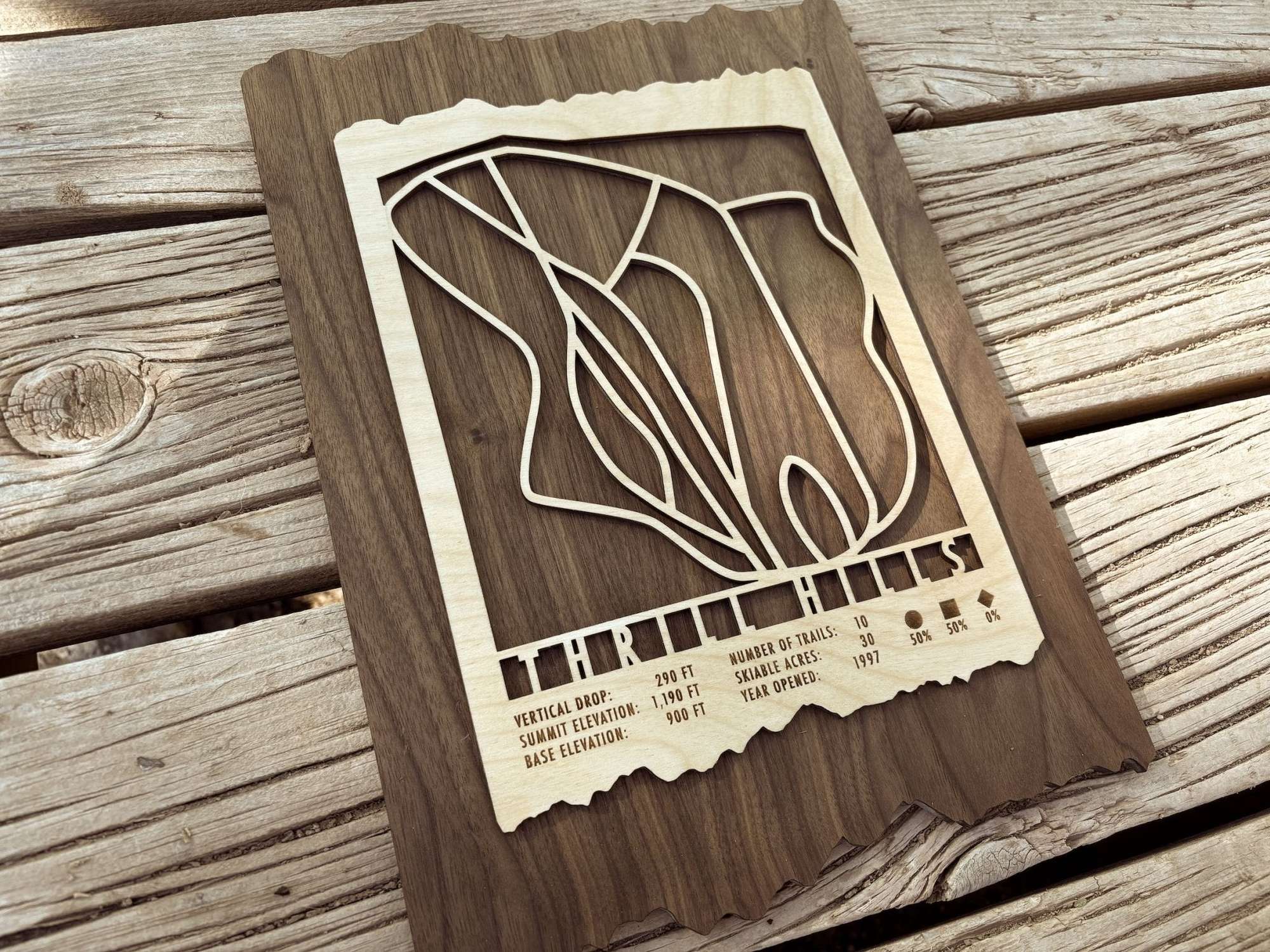 Wooden Thrill Hills Ski Trail Map decor featuring engraved ski routes and elevation data, ideal for home or cabin wall display.