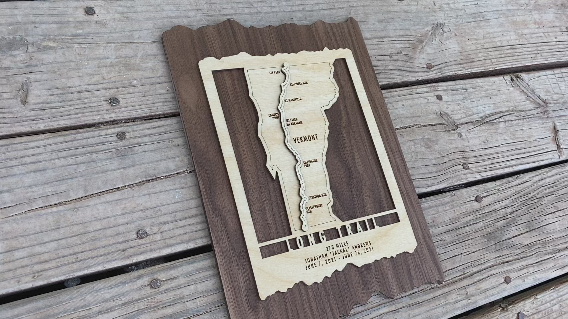 Angled view of Vermont Long Trail wood wall map showing engraved trail and personalized hiking dates, perfect for rustic home decor.